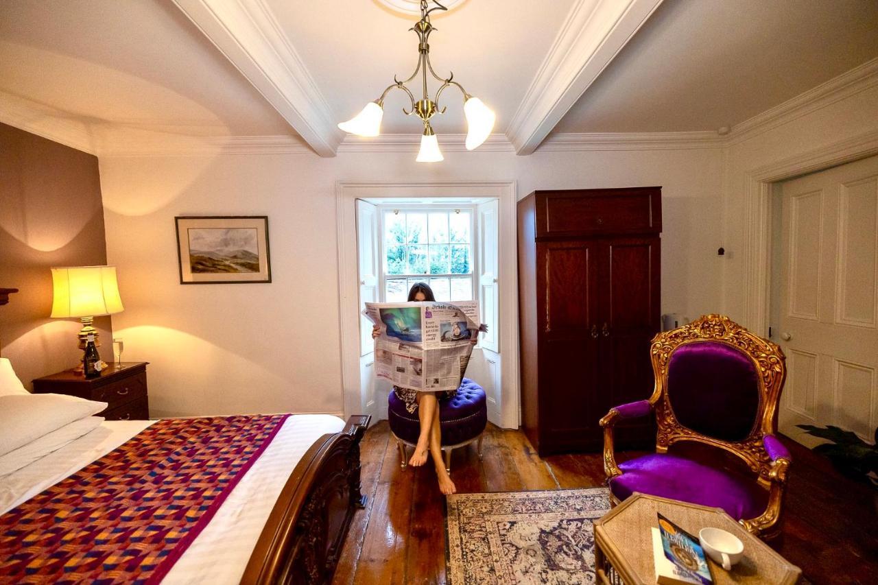 Clone Country House Aughrim Ngoại thất bức ảnh A guest reading the Irish Times in the hotel